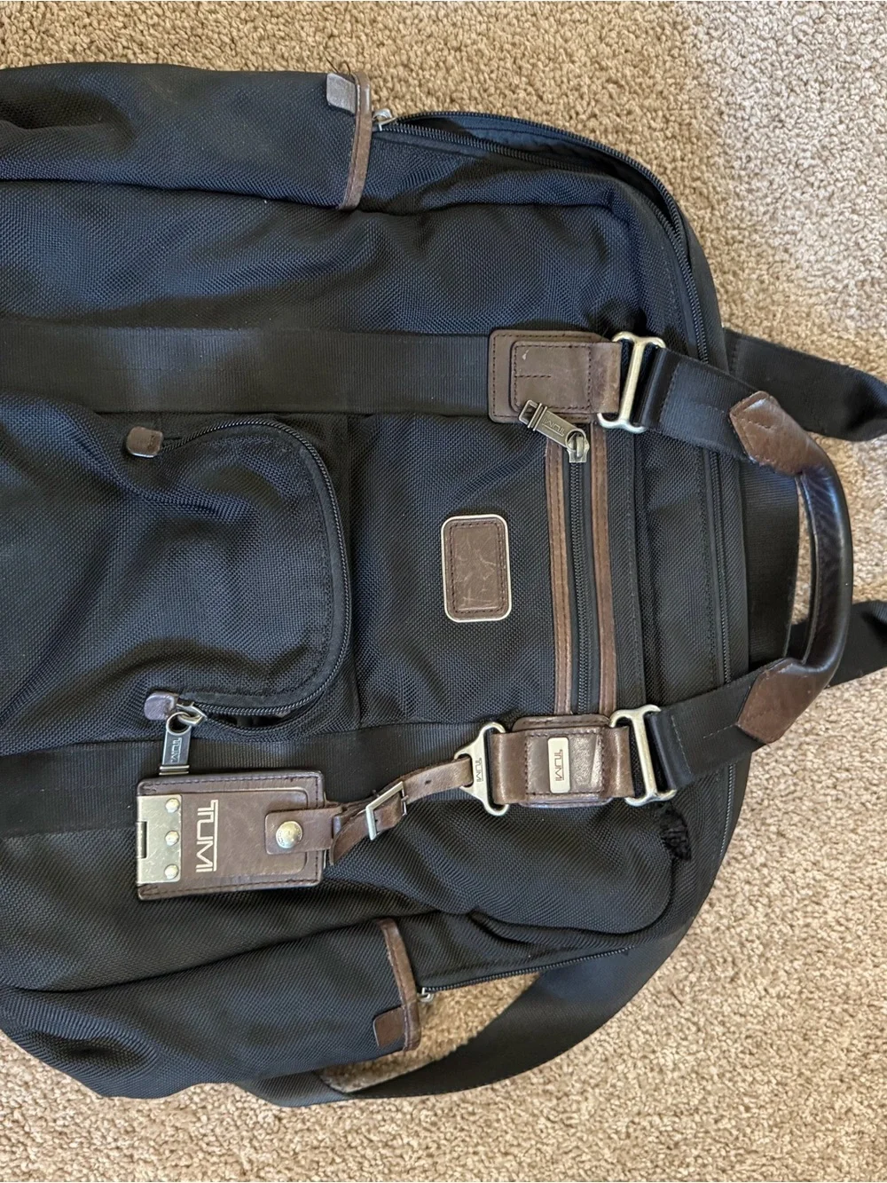 Tumi Black Backpack with Brown Leather Accents